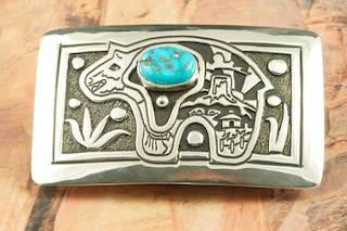 Genuine Sleeping Beauty Turquoise set in Sterling Silver Belt Buckle. Stunning Bear Design. Created by Navajo Artist Tommy Singer. Signed by the artist.